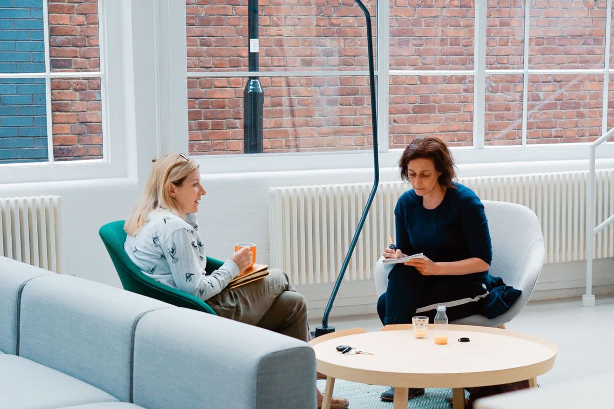 Two Women Sat In An Office